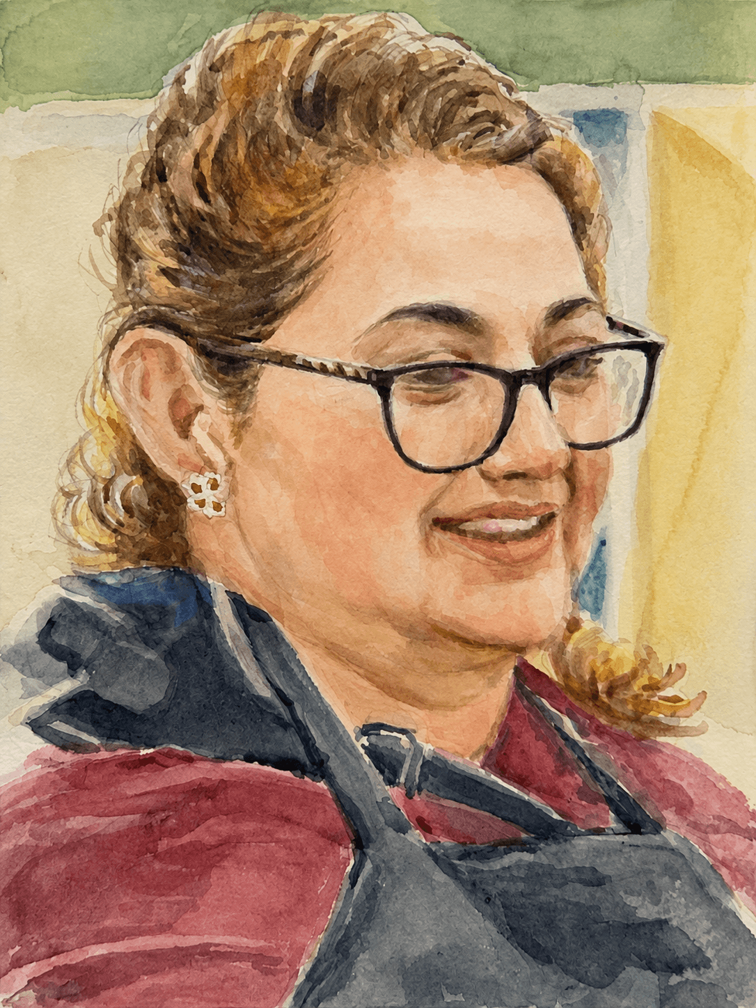 Smiling woman with glasses in a red top