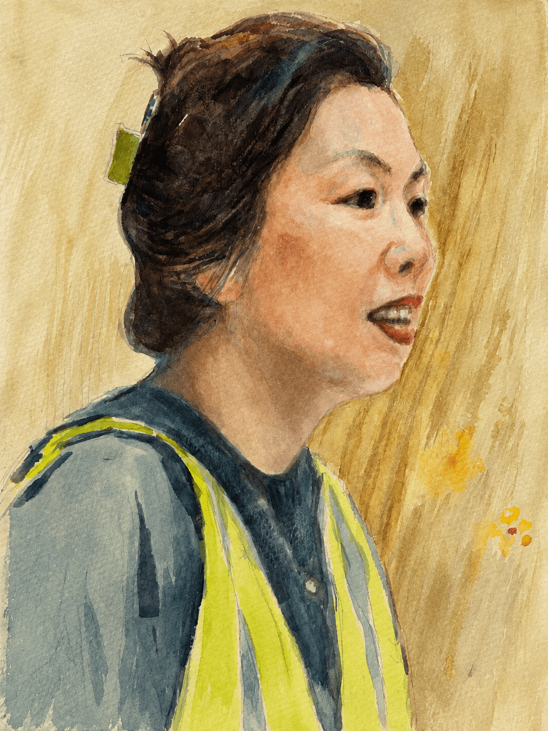 Side-profile portrait in a green safety vest